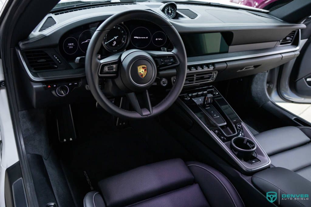 The interior of a porsche 911 turbo s is shown.