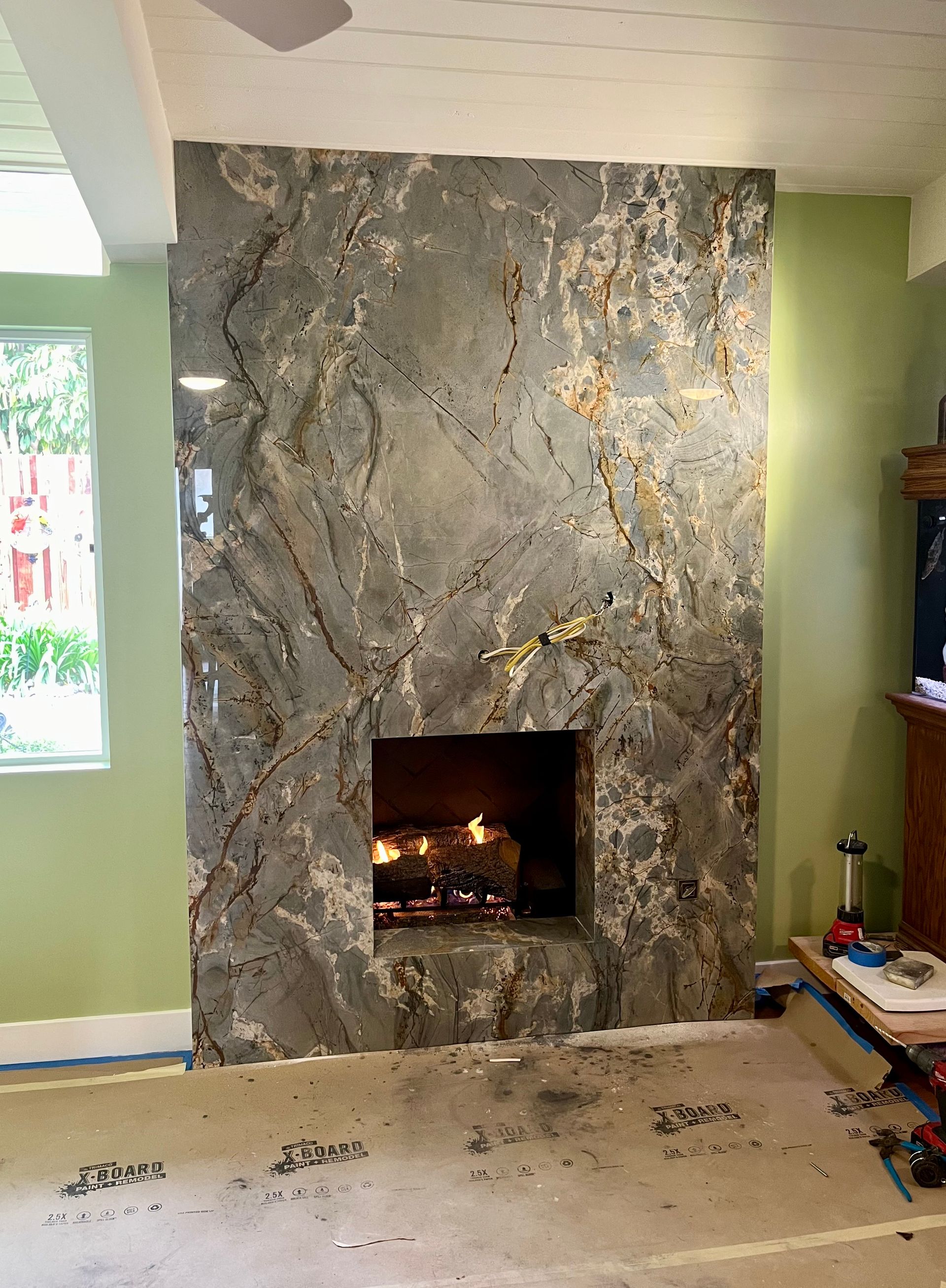 There is a fireplace in the middle of the room.