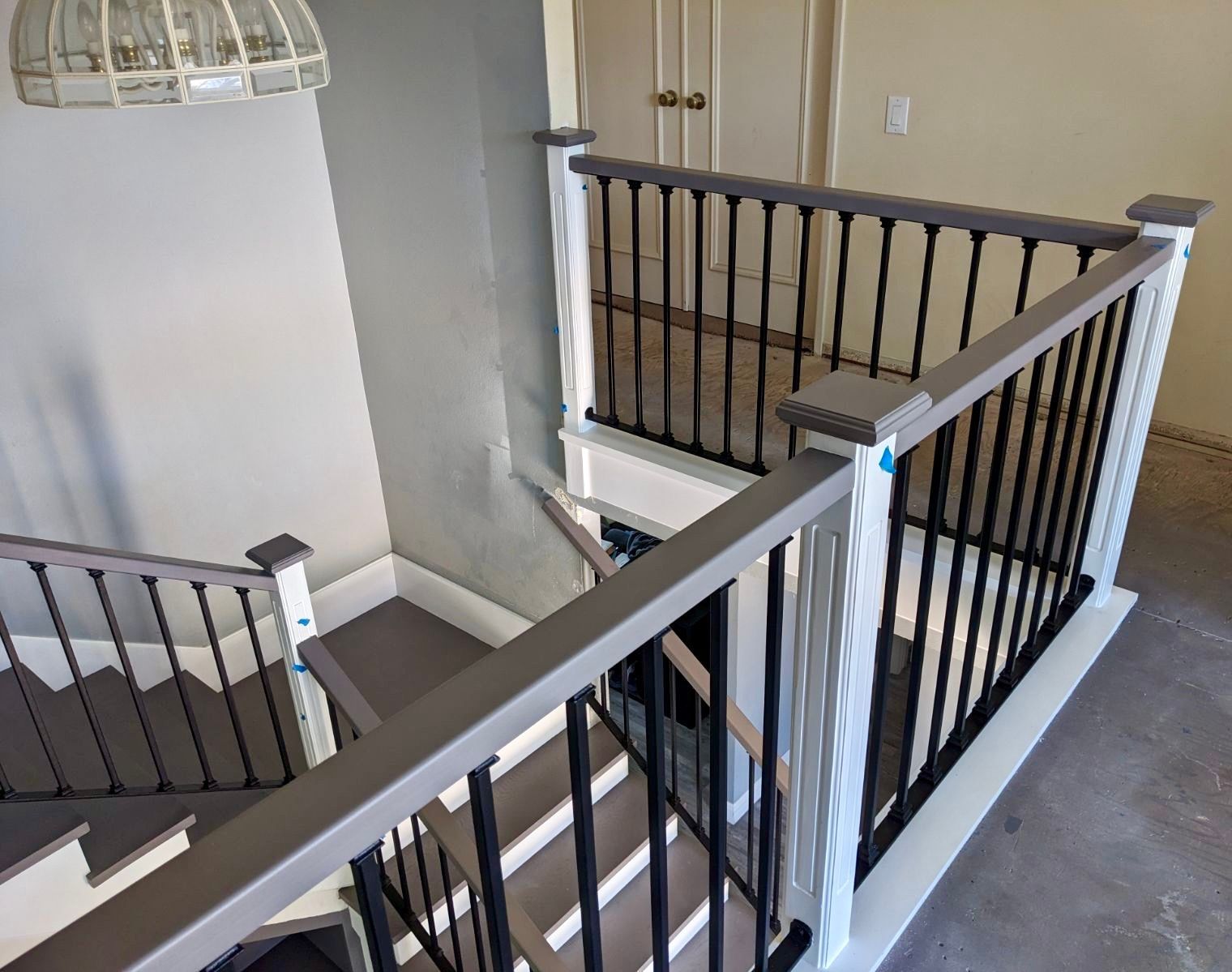 A view of a staircase from the second floor of a house.