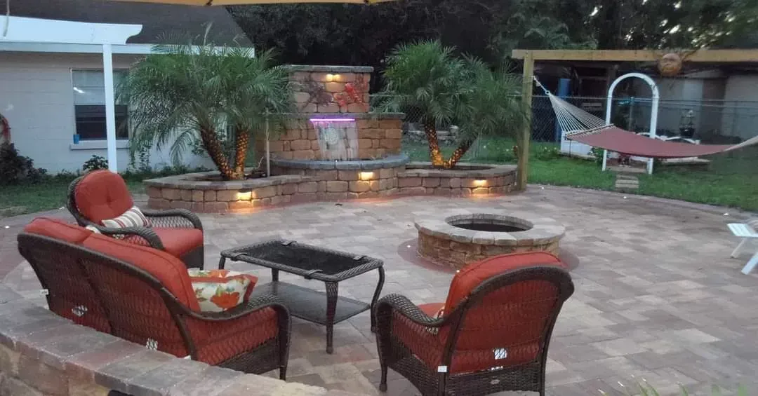 There is a fire pit in the middle of the patio.