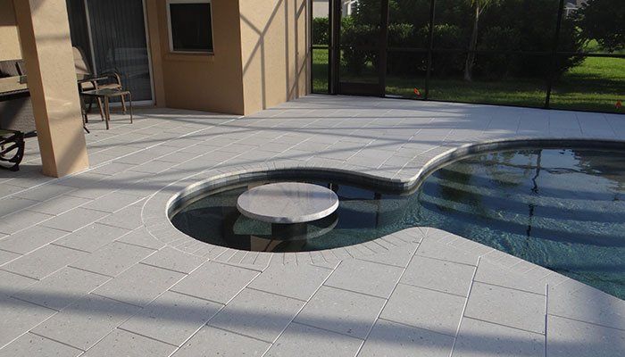 Pool with a small circular island - Pool & Deck Construction in Sarasota, FL