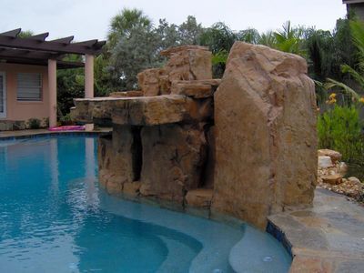 Custom Shaped Pool with big rock - Pool & Deck Construction in Sarasota, FL