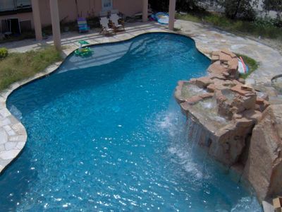 Custom Shaped Pool with big rock - Pool & Deck Construction in Sarasota, FL