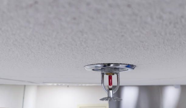 A Fire Sprinkler is Hanging from the Ceiling of a Room - Fire Sprinkler Services in Fort Wayne, IN