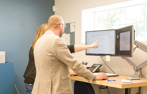 Two People Staring At Monitor — Grand Junction, CO — Haining Home Services