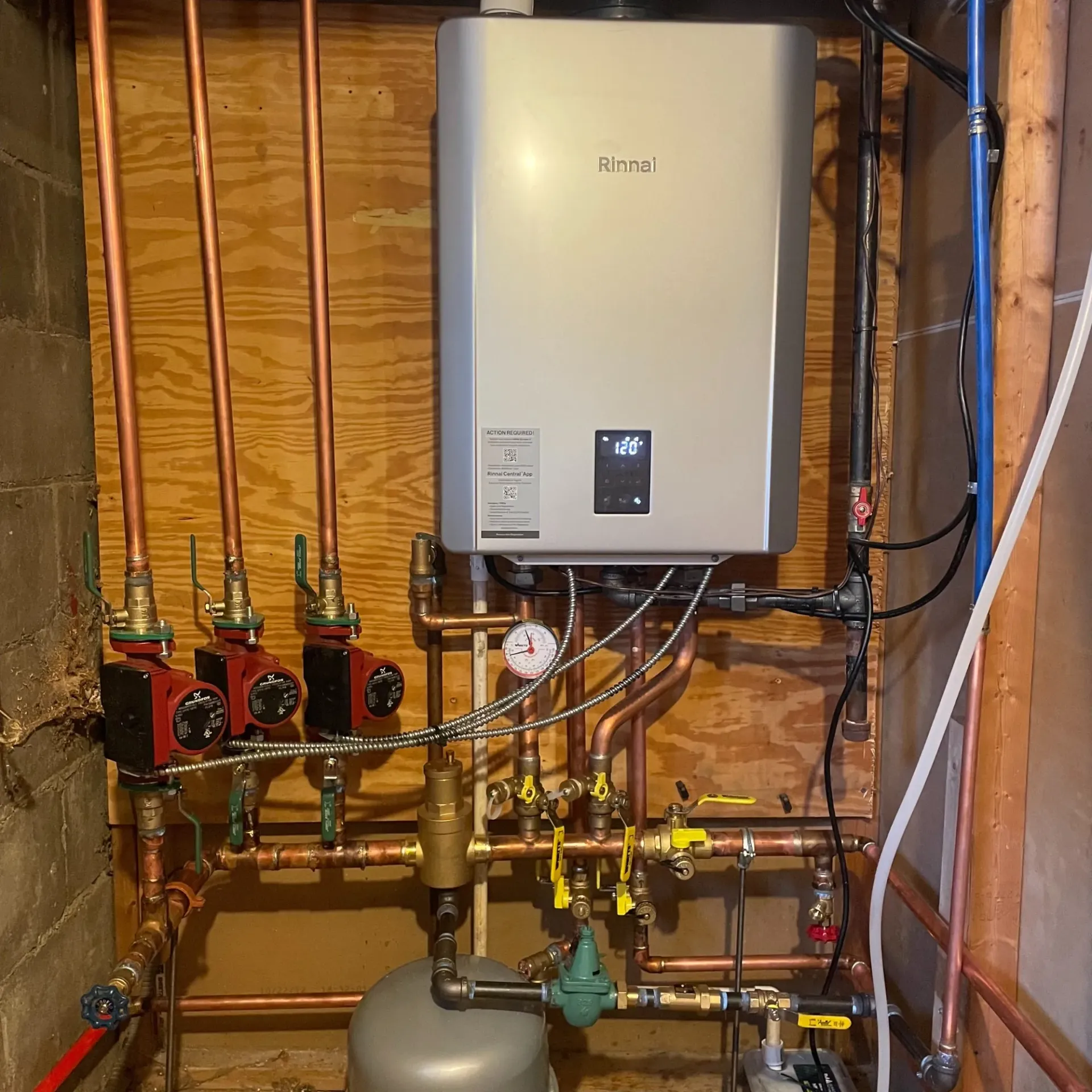 Apex Climate Control - A boiler with the word rinnai on it