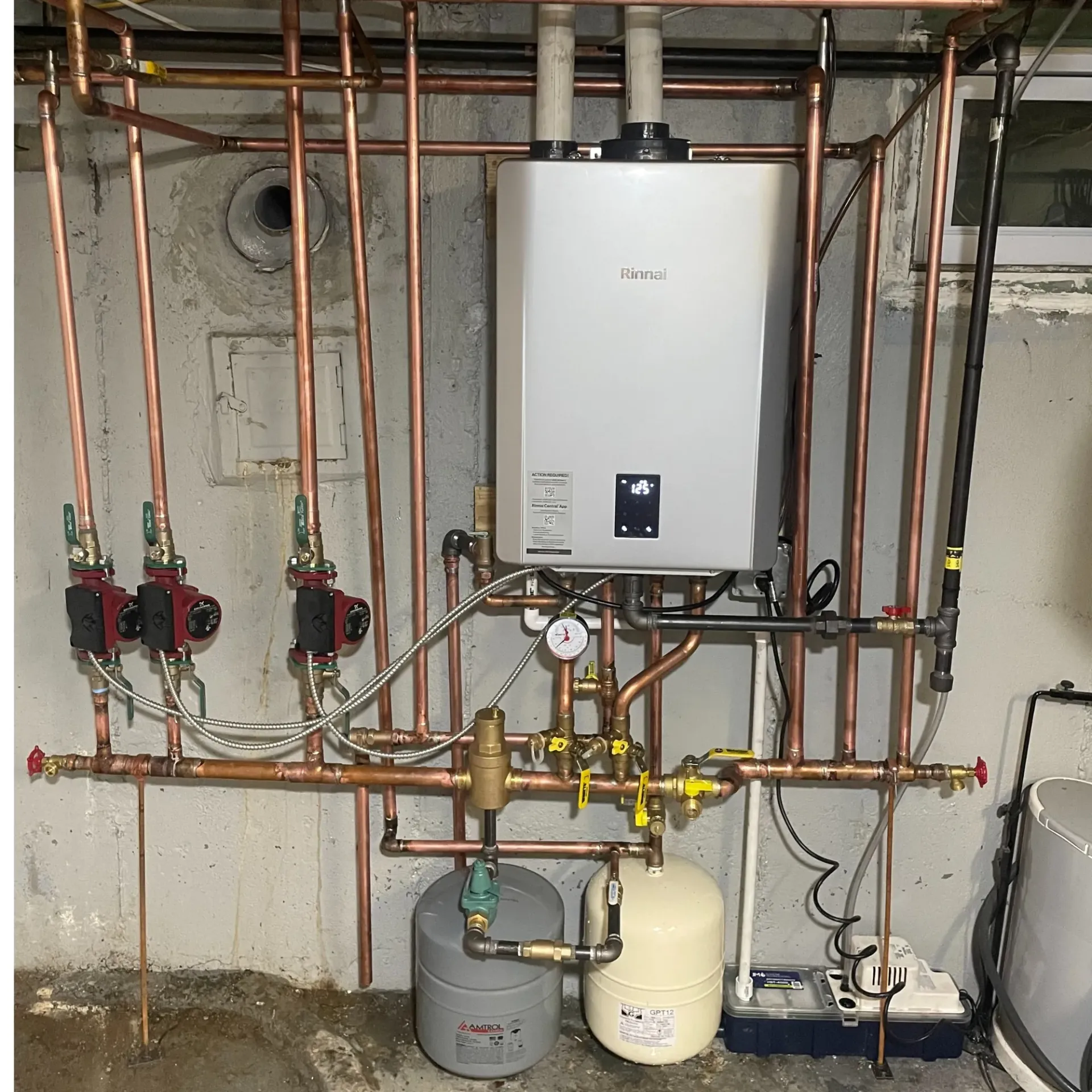 Apex Climate Control - A white water heater is surrounded by copper pipes