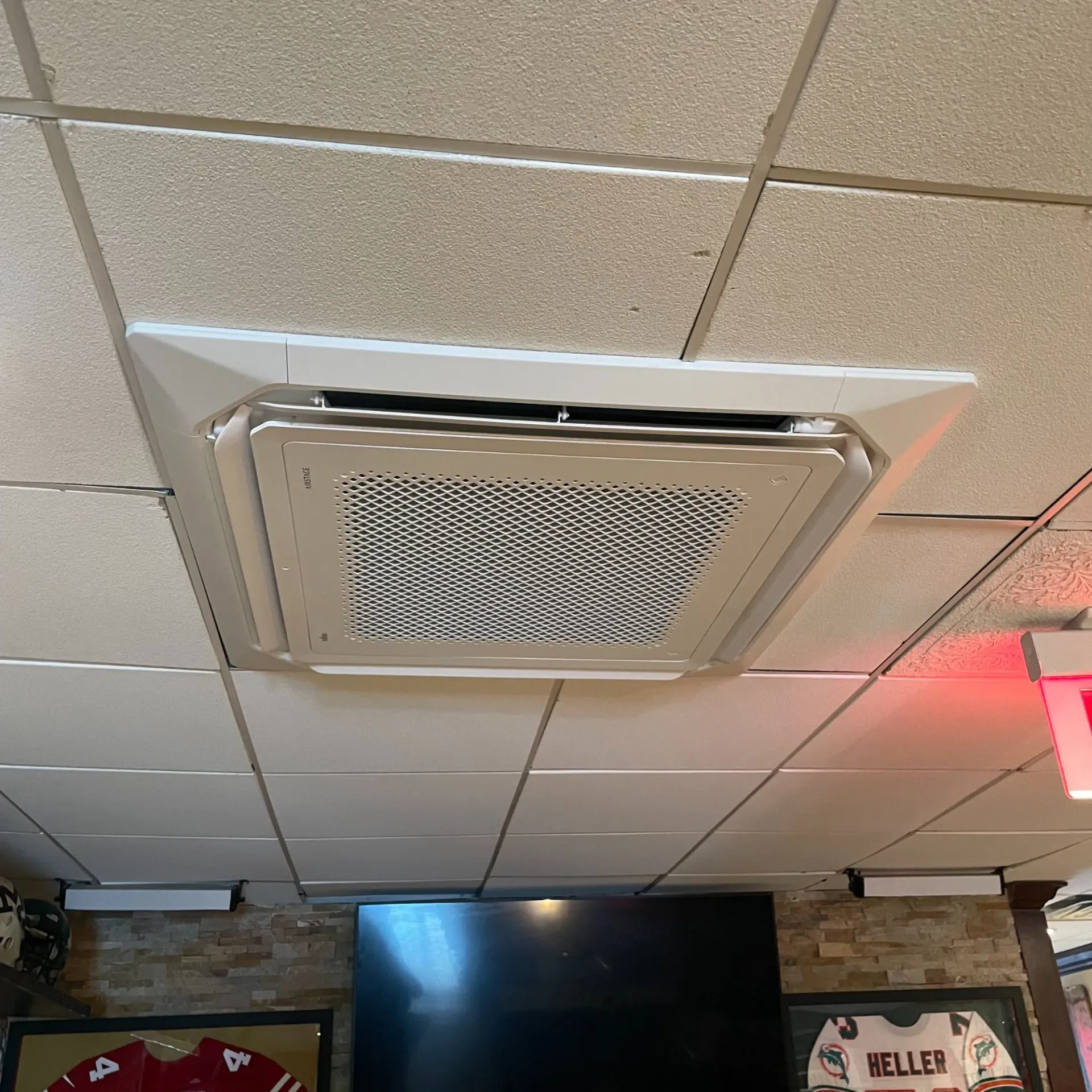 Apex Climate Control - A ceiling fan is hanging from the ceiling of a room.
