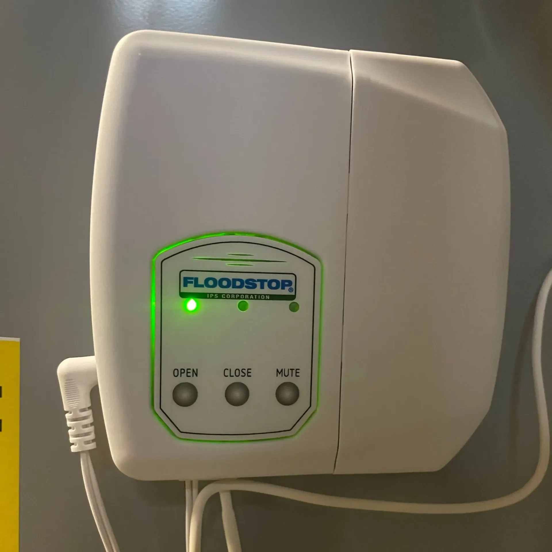 Apex Climate Control - A floodstop device is plugged into a wall