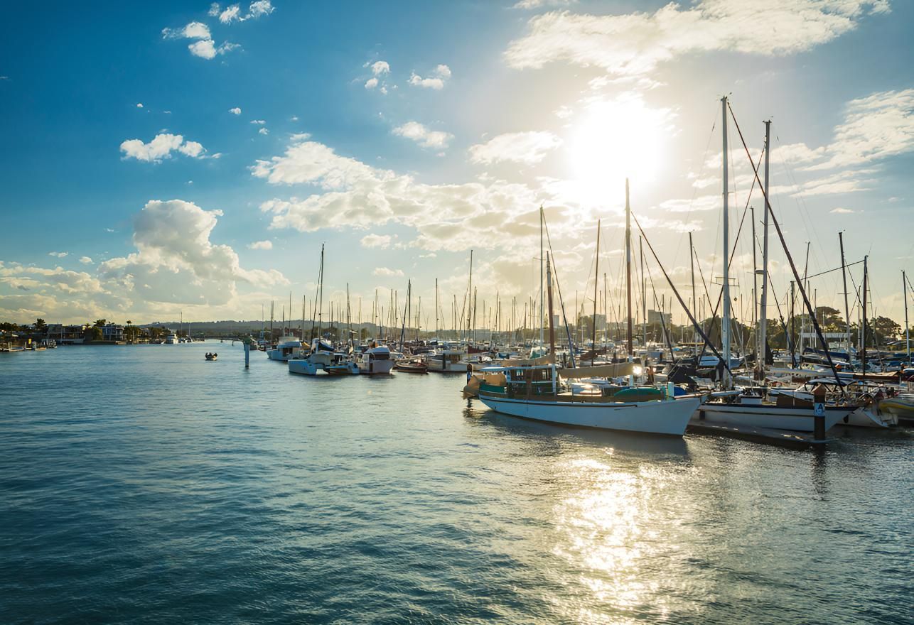 A Bunch Of Boats Are Docked In A Harbor — The Boat Cover Company In Maroochydore, QLD
