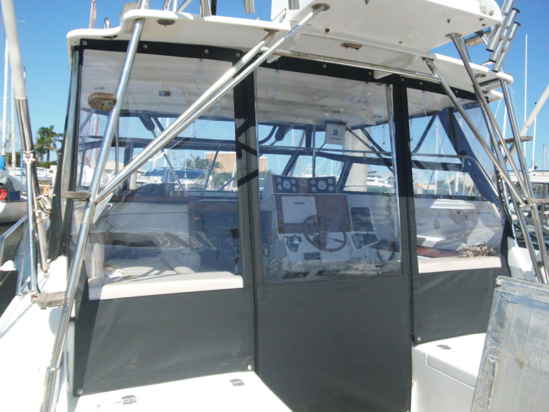 A White Boat is Sitting on the Deck of a Ship — The Boat Cover Company In Maroochydore, QLD