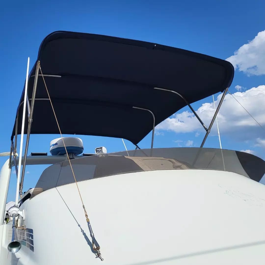 White Boat With a Dark Blue Canopy Under a Clear Blue Sky — The Boat Cover Company In Buddina, QLD