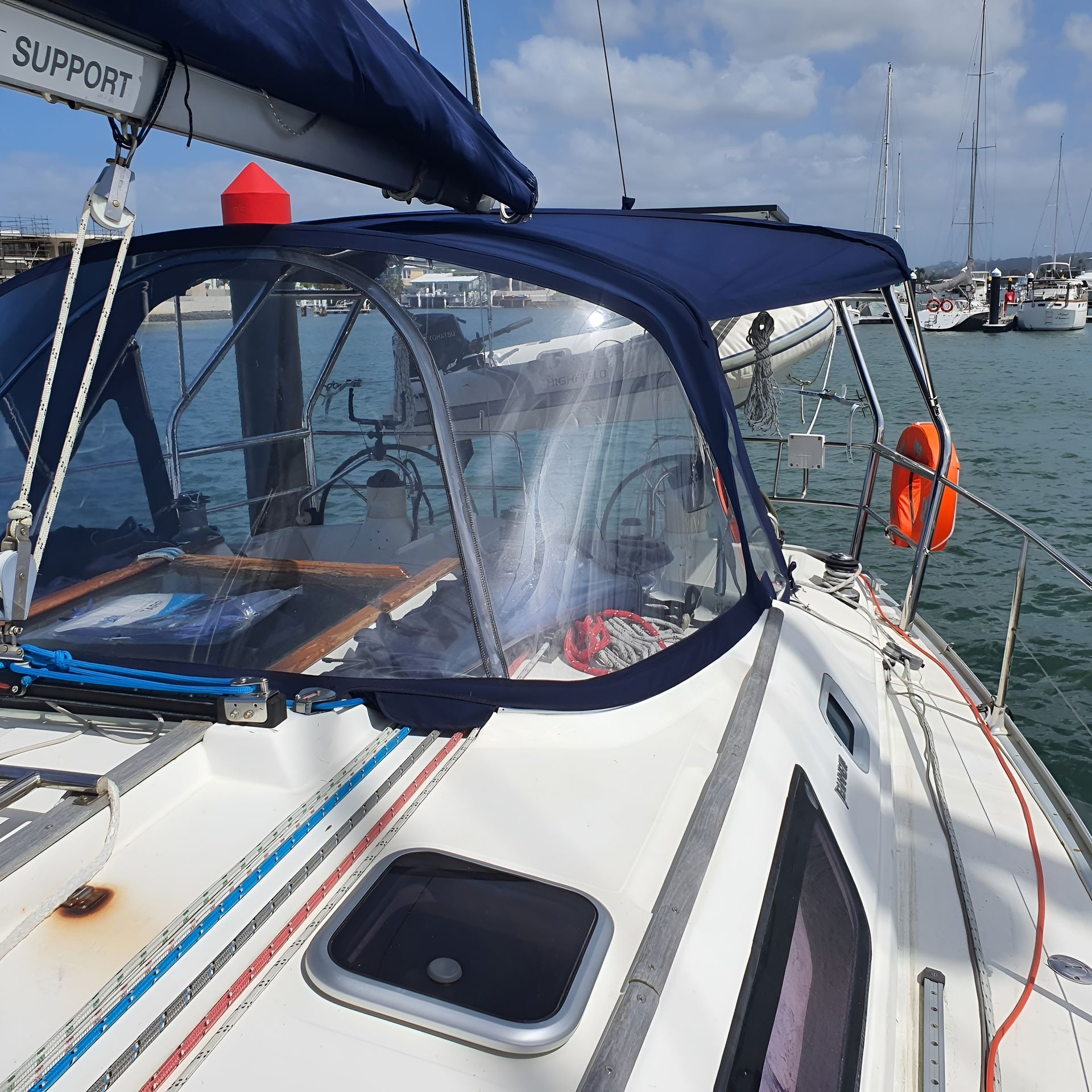 Sailboat With Blue Canvas, Clear Windscreen, and Life Ring — The Boat Cover Company In Buddina, QLD