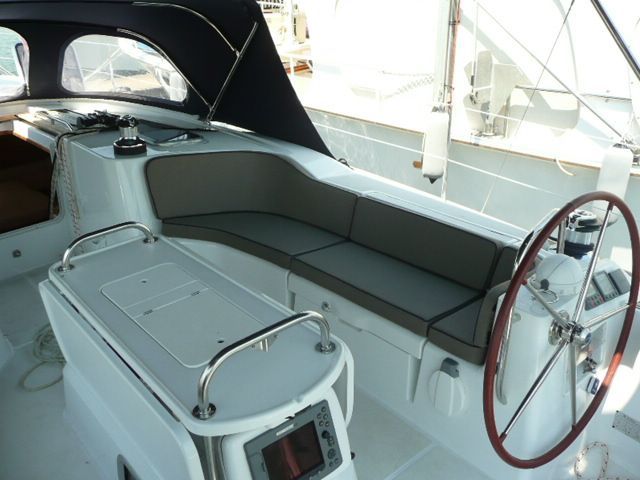 A boat with a steering wheel and a seat — The Boat Cover Company In Buddina, QLD