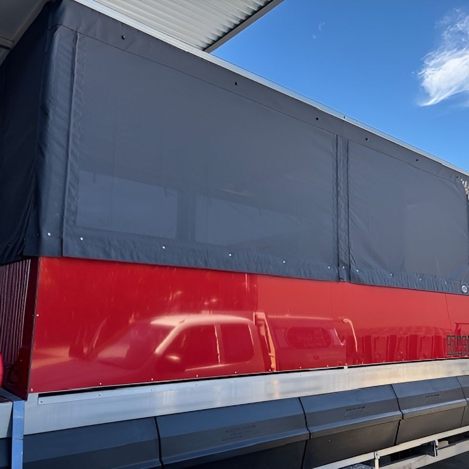 Red Vehicle With Black Tarp Cover, Parked Outside, Blue Sky Visible — The Boat Cover Company In Buddina, QLD