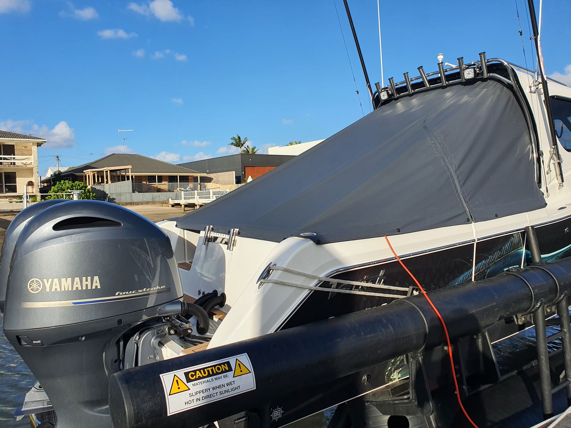 A yamaha outboard motor is attached to a boat — The Boat Cover Company In Buddina, QLD