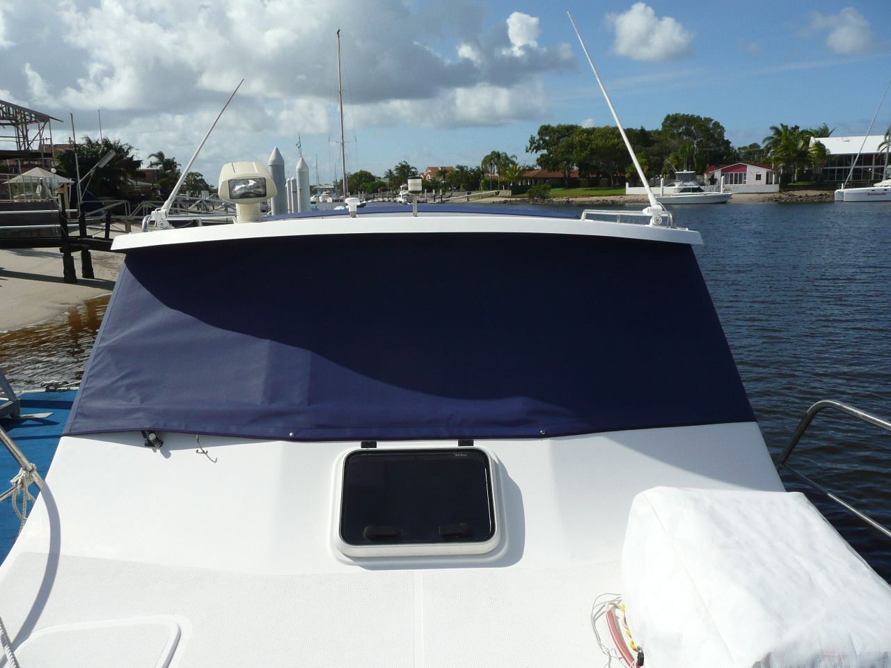 The front of a boat with a blue cover on it The Boat Cover Company In Buddina, QLD