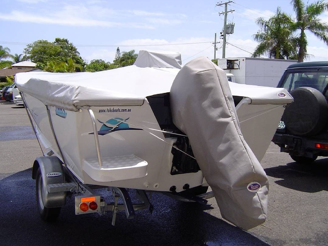 Small White Boat on a Trailer, Covered With a Tan Tarp — The Boat Cover Company In Buddina, QLD