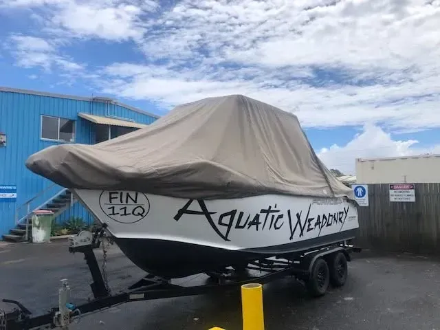 White Boat on a Trailer, Covered With a Tan Tarp — The Boat Cover Company In Buddina, QLD