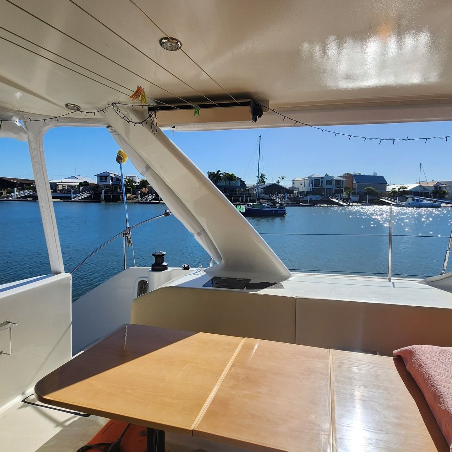 View From a Boat's Deck With a Table, Overlooking a Harbor — The Boat Cover Company In Buddina, QLD
