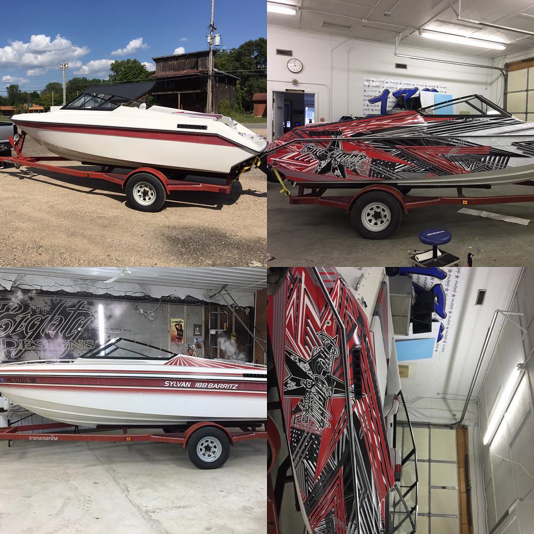 A boat is sitting on a trailer in a garage.