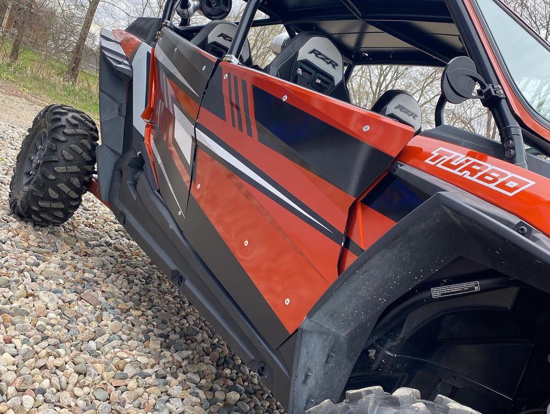 A red and black atv with the word turbo on the side
