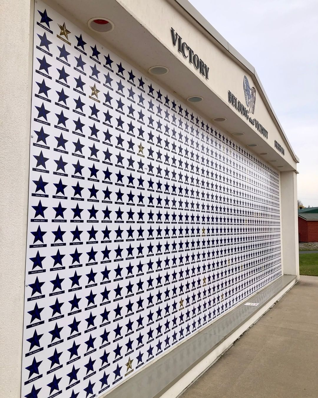 The word victory is on the side of a building