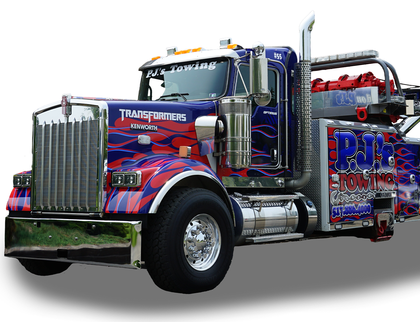 A blue and red tow truck with transformers painted on it