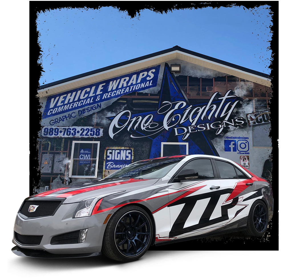 A car is parked in front of a building that says vehicle wraps.