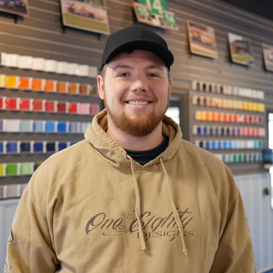 A man wearing a hoodie that says one eighty