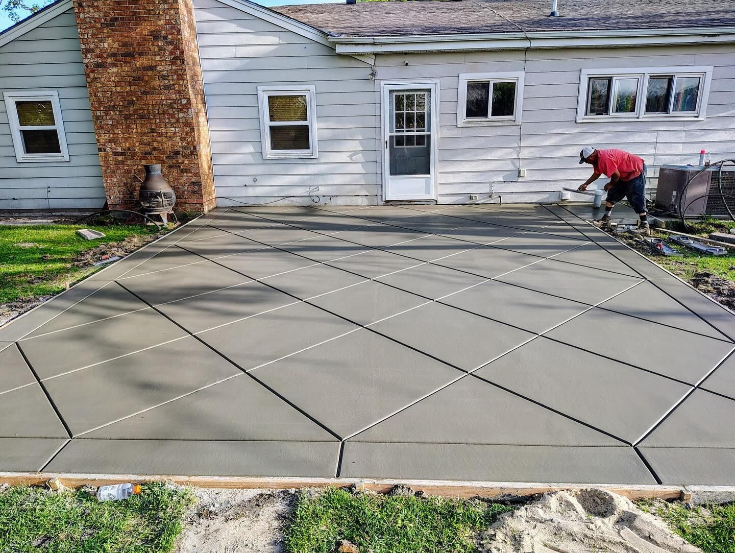  concrete driveway in front of a house.