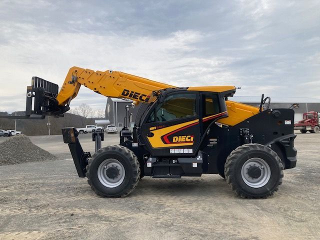 A yellow and black forklift is parked in a dirt lot.