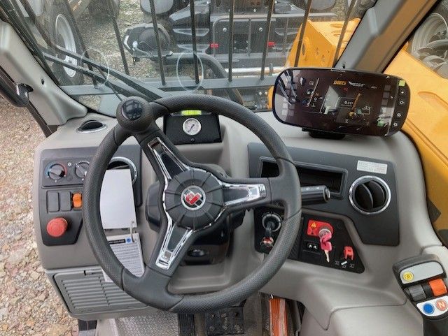 A close up of a steering wheel on a vehicle