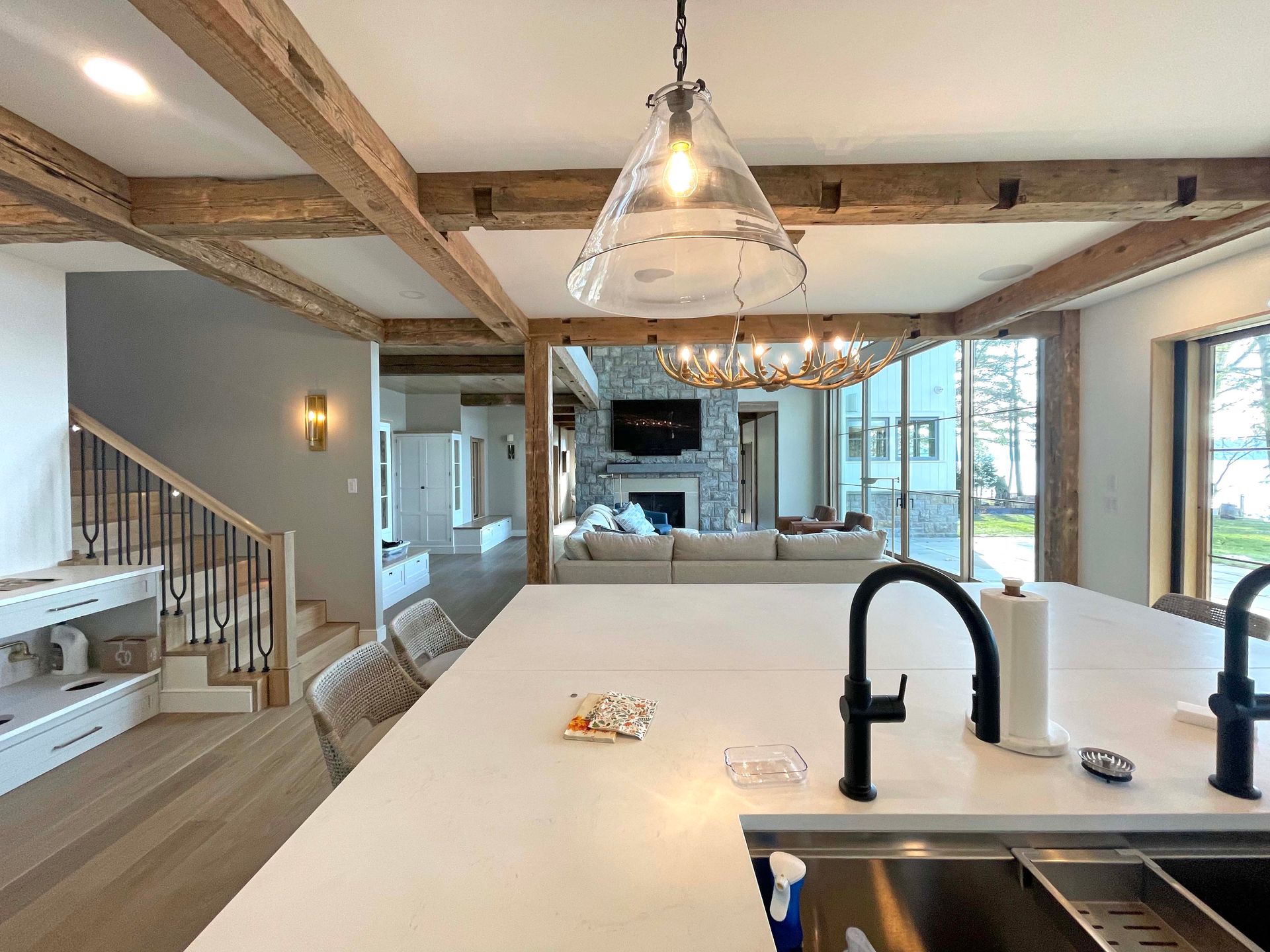 A kitchen with a stainless steel sink and a large island.
