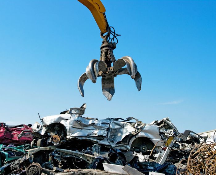 Crane Picking Up Crushed Cars — Kearny, NJ — Bibbs Auto Recycling