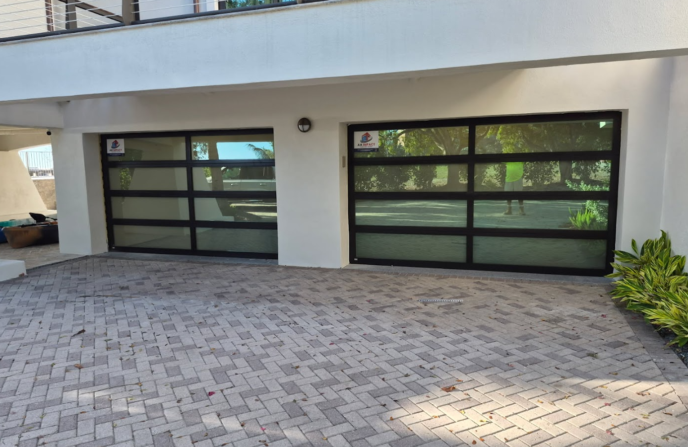 A house with a lot of windows and a blue rug