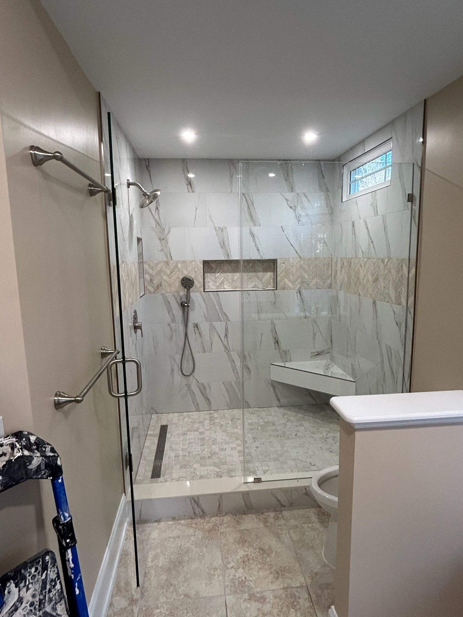 A bathroom with a bathtub , sink and mirror.