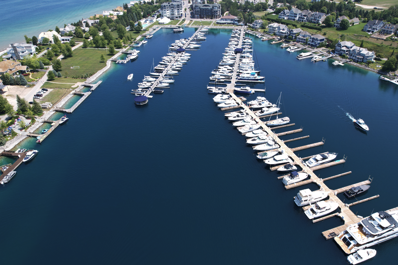 An aerial view of a marina with many boats docked