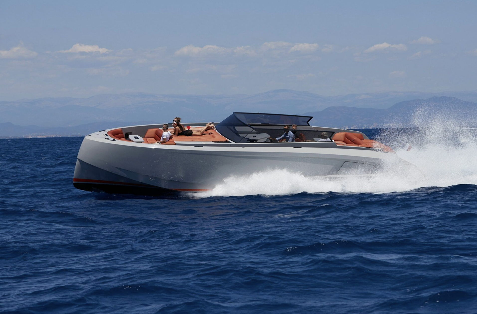 A boat is floating on top of a large body of water.
