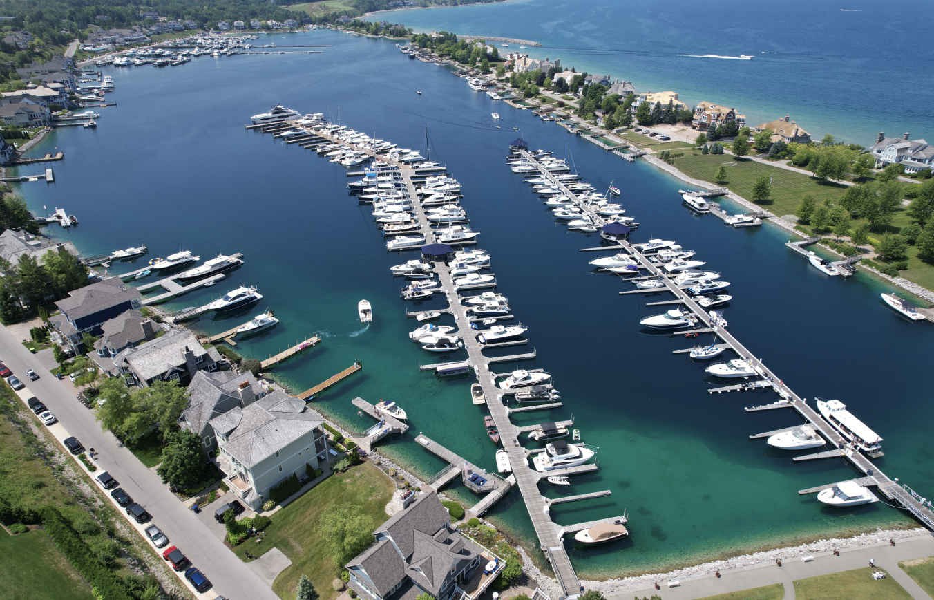 An aerial view of a marina with many boats docked