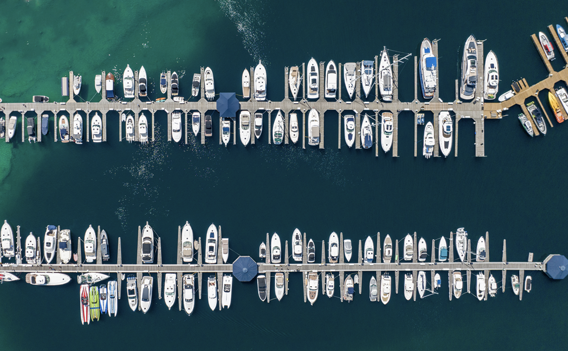 An aerial view of a marina with boats docked