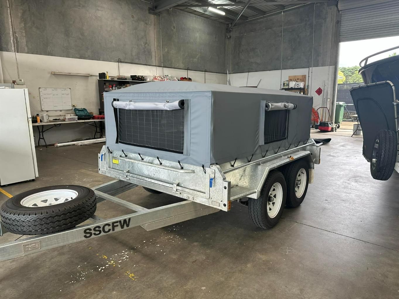 8x5 Trailer With Cover In The Garage — Cairns Vinyl & Canvas in Bungalow, QLD