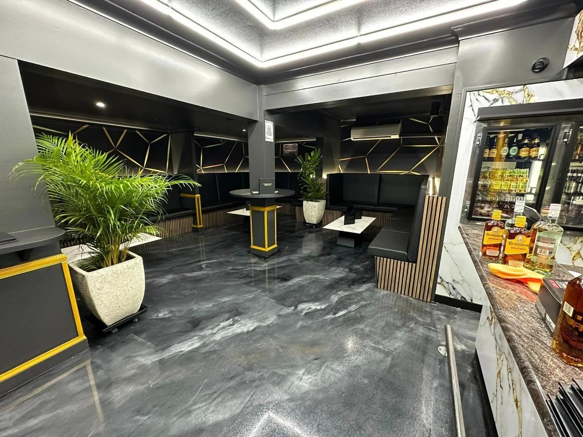 Interior Of The Cocktail Bar With Black Chairs — Cairns Vinyl & Canvas in Bungalow, QLD