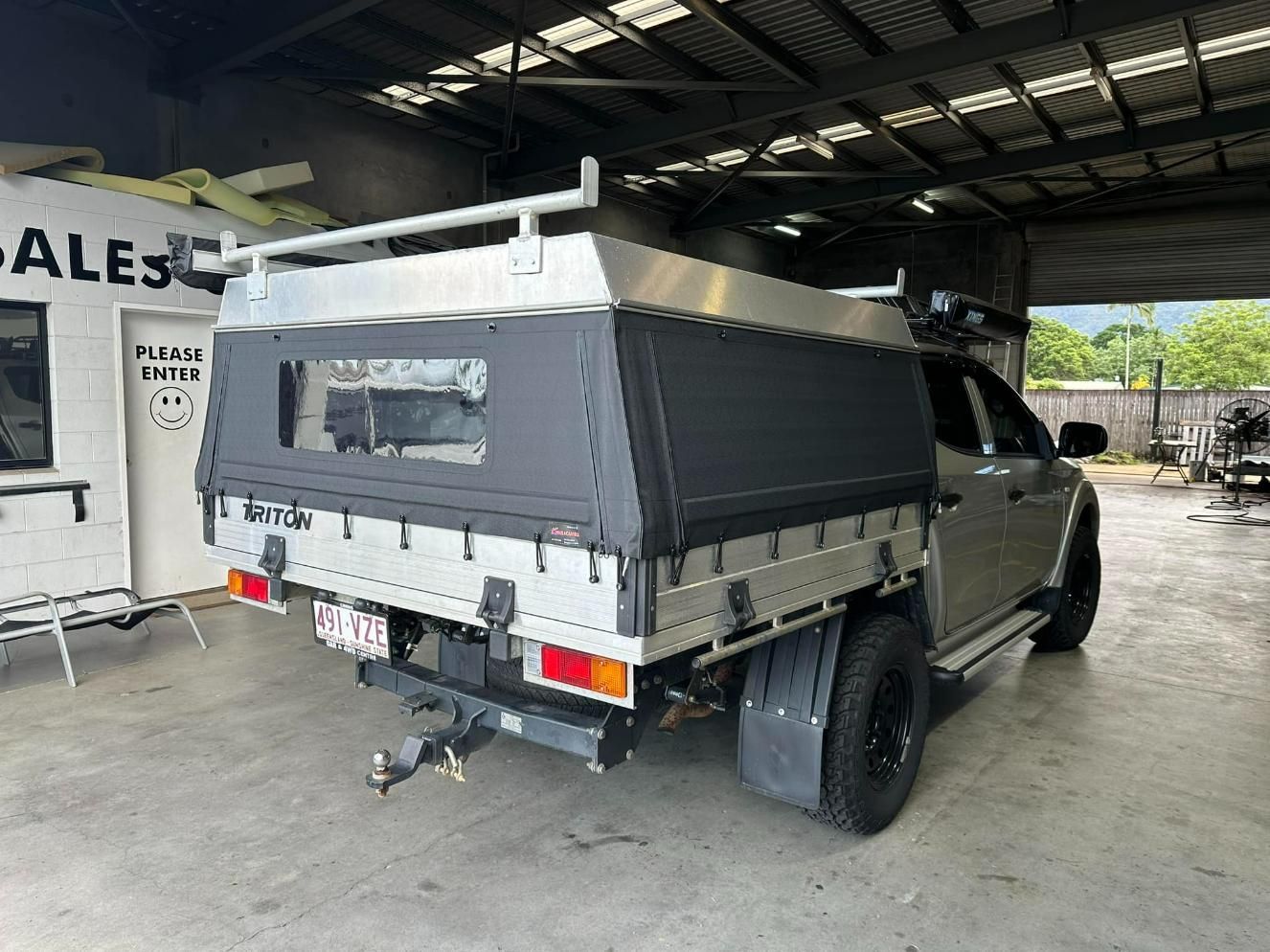 Truck with A Canopy on Top of It Is Parked in A Garage — Cairns Vinyl & Canvas in Bungalow, QLD