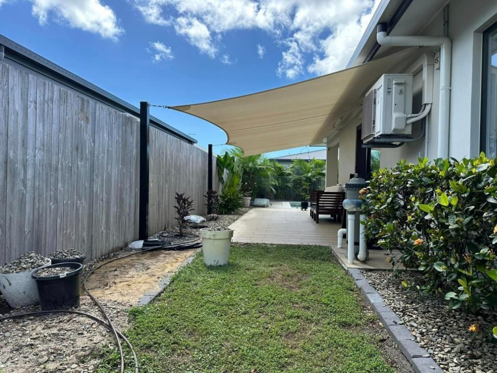 Beige Shade Sails In The Backyard Of The House — Cairns Vinyl & Canvas in Bungalow, QLD