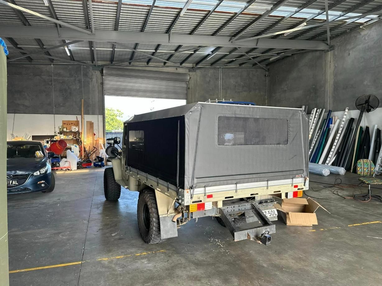 Truck With A Canopy Is Parked In A Garage — Cairns Vinyl & Canvas in Bungalow, QLD