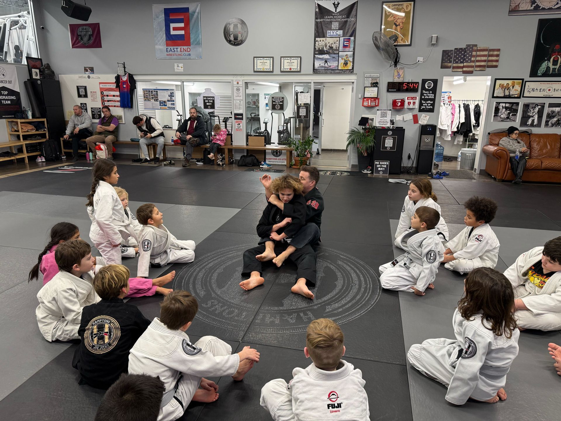 Students practice controlled brazilian jiu jitsu sparring at Hamptons Jiu-Jitsu in Southampton, NY.