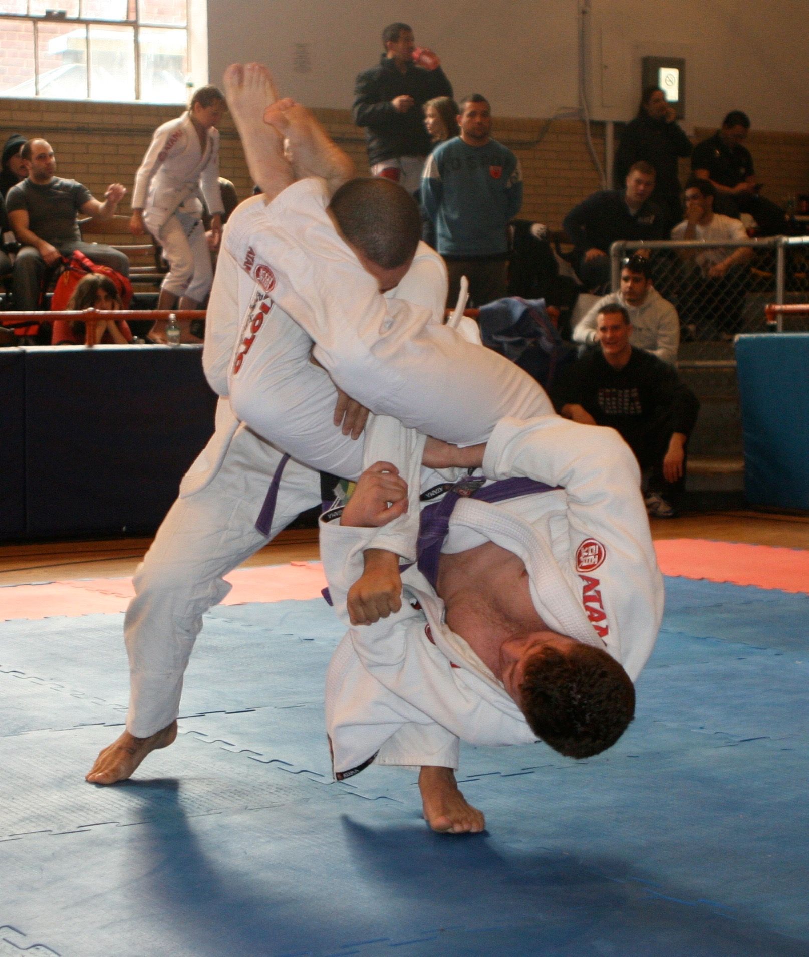 Instructor demonstrating grip fighting techniques at Hamptons Jiu-Jitsu in Southampton NY during BJJ