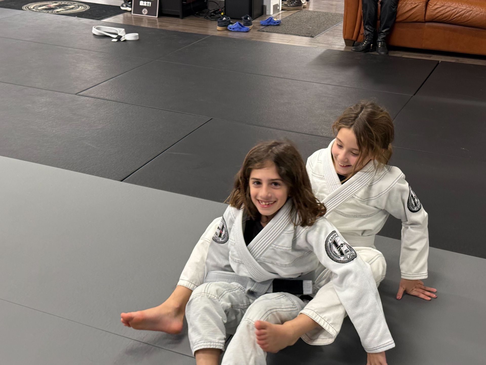 Students practicing Brazilian jiu jitsu mental resilience techniques at Hamptons Jiu-Jitsu academy.
