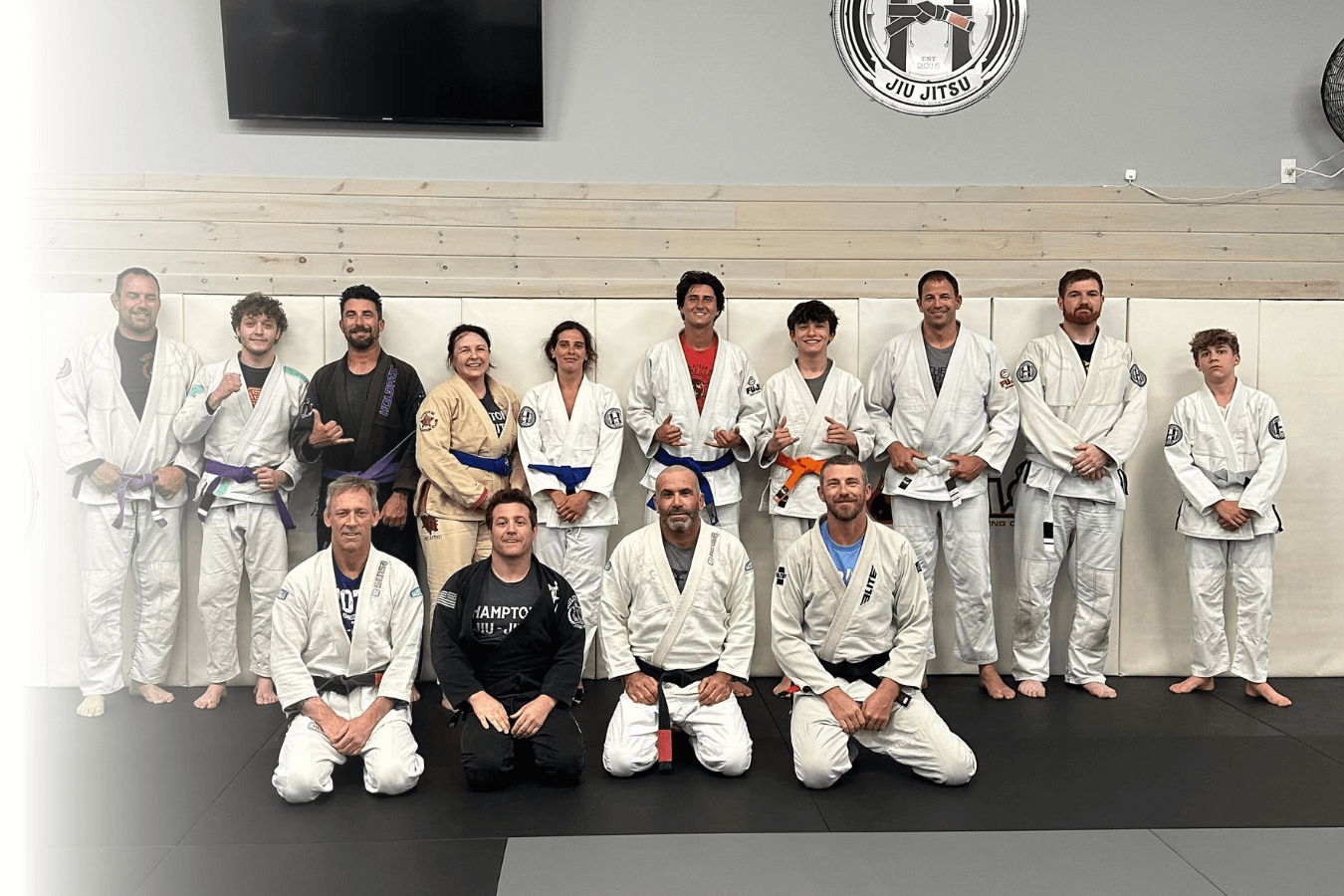 Adults drilling Brazilian Jiu-Jitsu techniques at Hamptons Jiu-Jitsu in Southampton, NY for fitness.